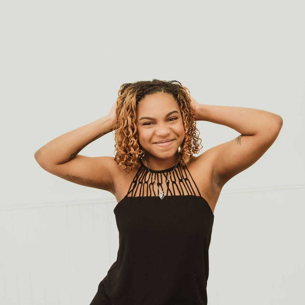 Portrait of Kristen, a professional stylist at Cactus Hair Salon, showcasing their expertise and style.