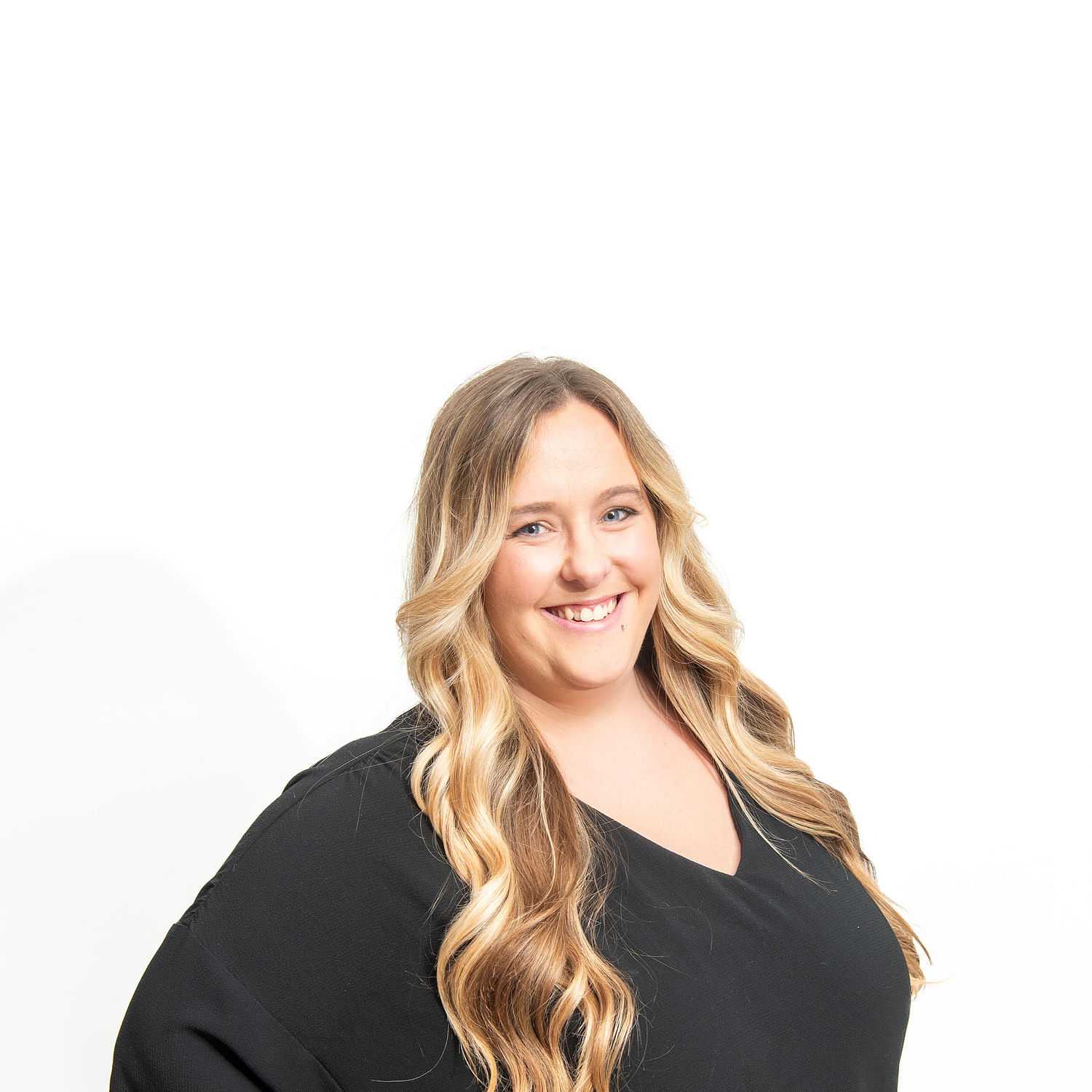 Portrait of Erin, a professional stylist at Cactus Hair Salon, showcasing their expertise and style.