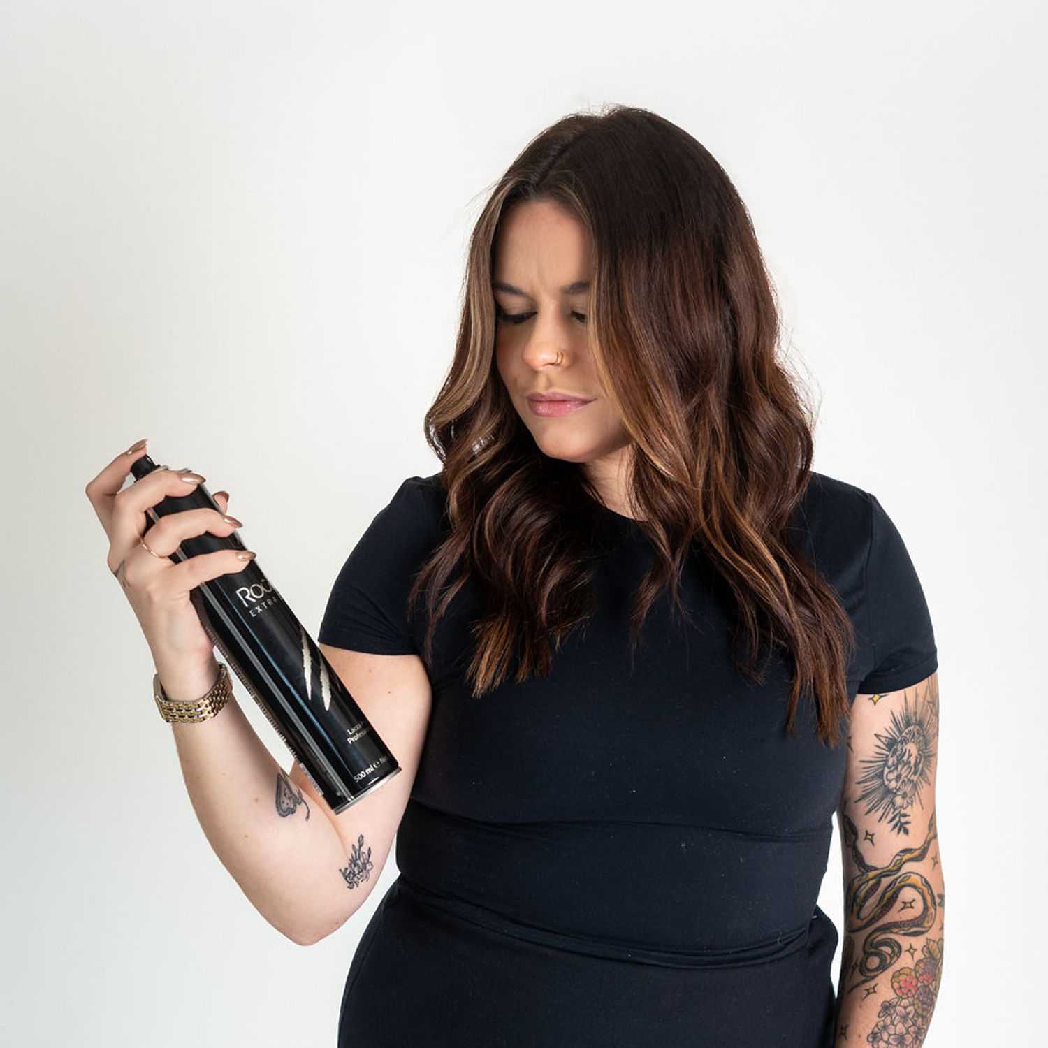 Portrait of Logan, a professional stylist at Cactus Hair Salon, showcasing their expertise and style.