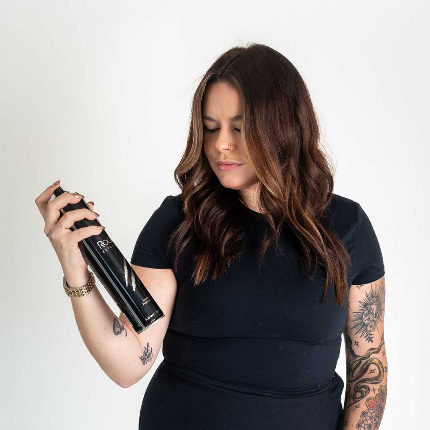 Portrait of Logan, a professional stylist at Cactus Hair Salon, showcasing their expertise and style.