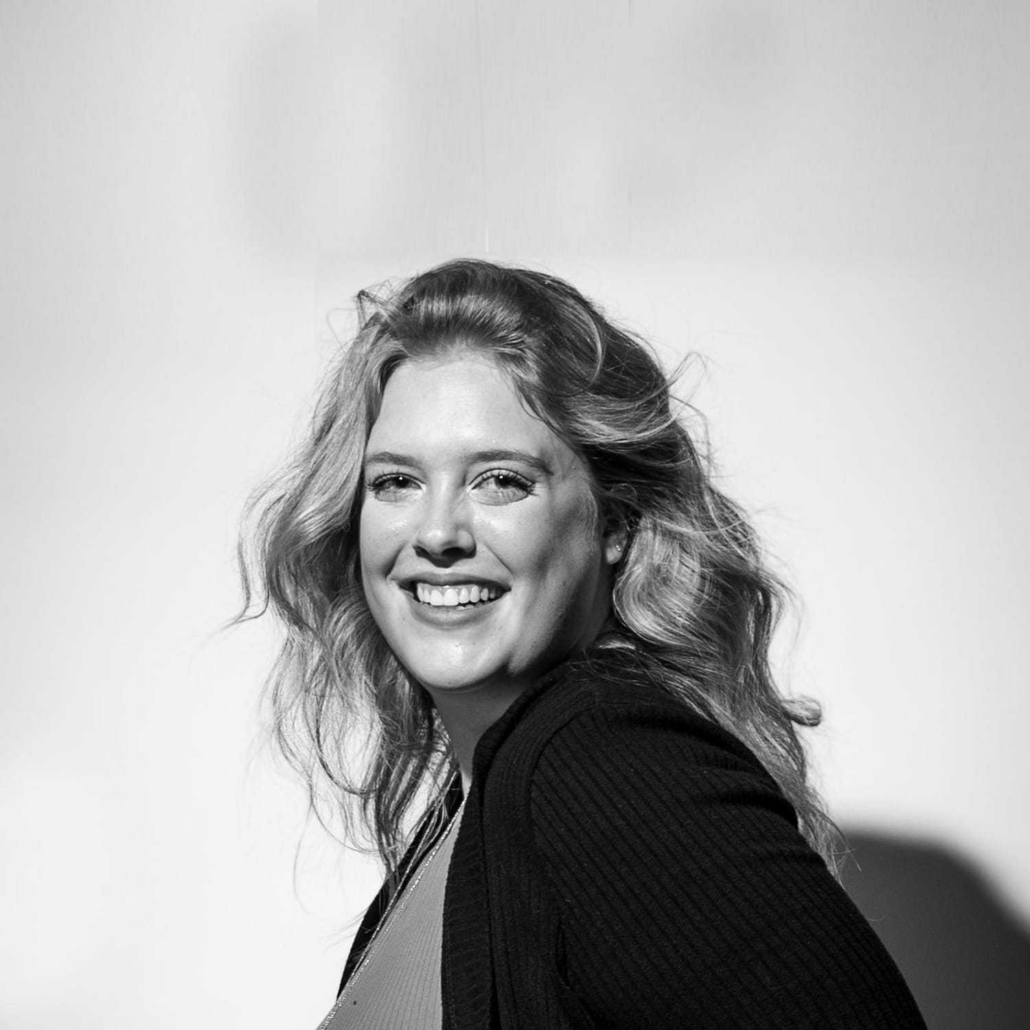 Portrait of Maddy, a professional stylist at Cactus Hair Salon, showcasing their expertise and style.